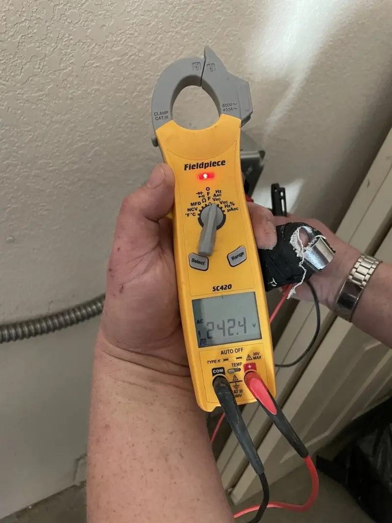Voltage testing with clamp meter during Electrical Installation Services in Santa Maria